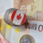 euro coin with national flag of canada on the euro money banknotes background